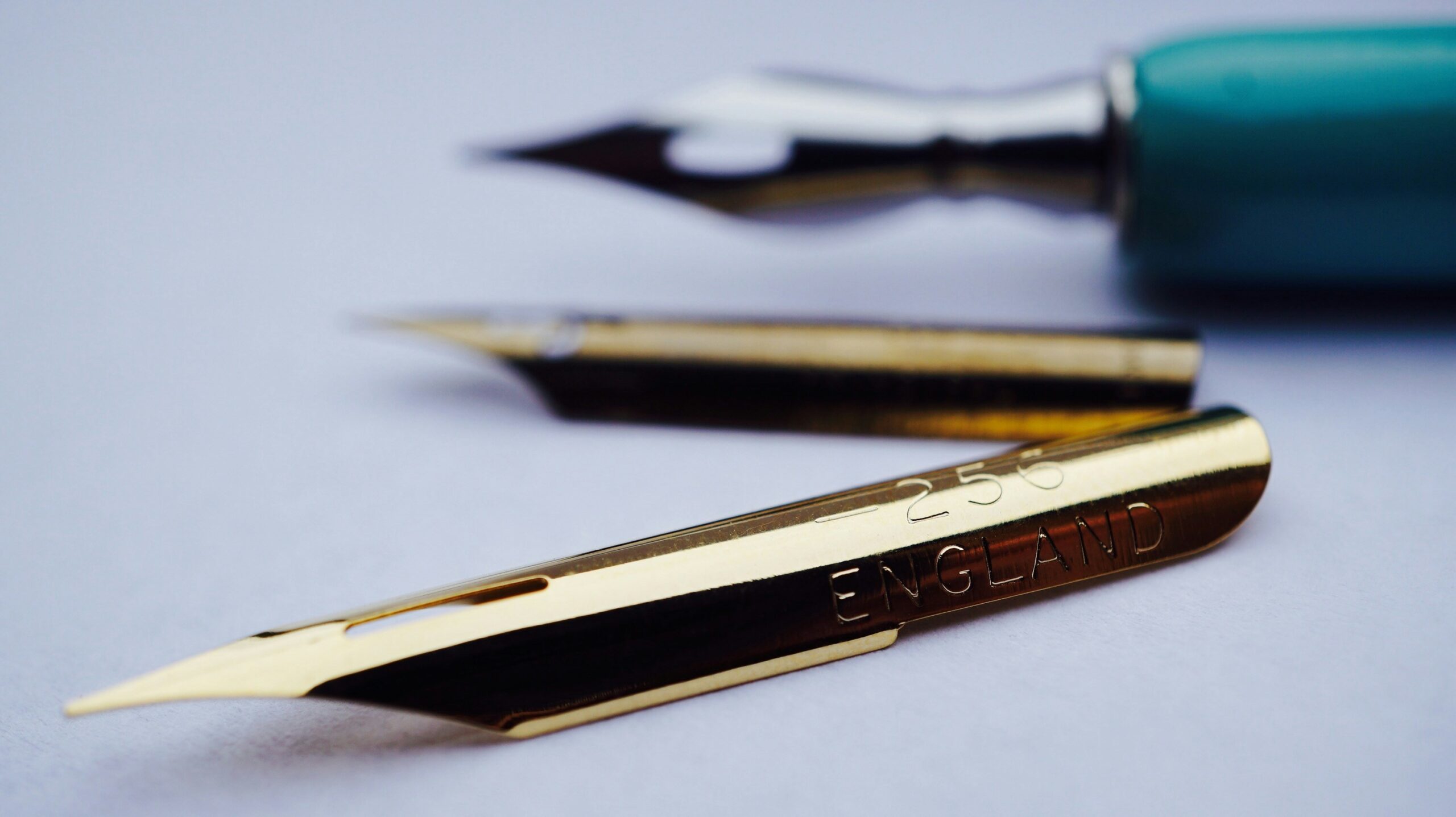 Comparison image showing difference between curved blade and flat blade nail clippers