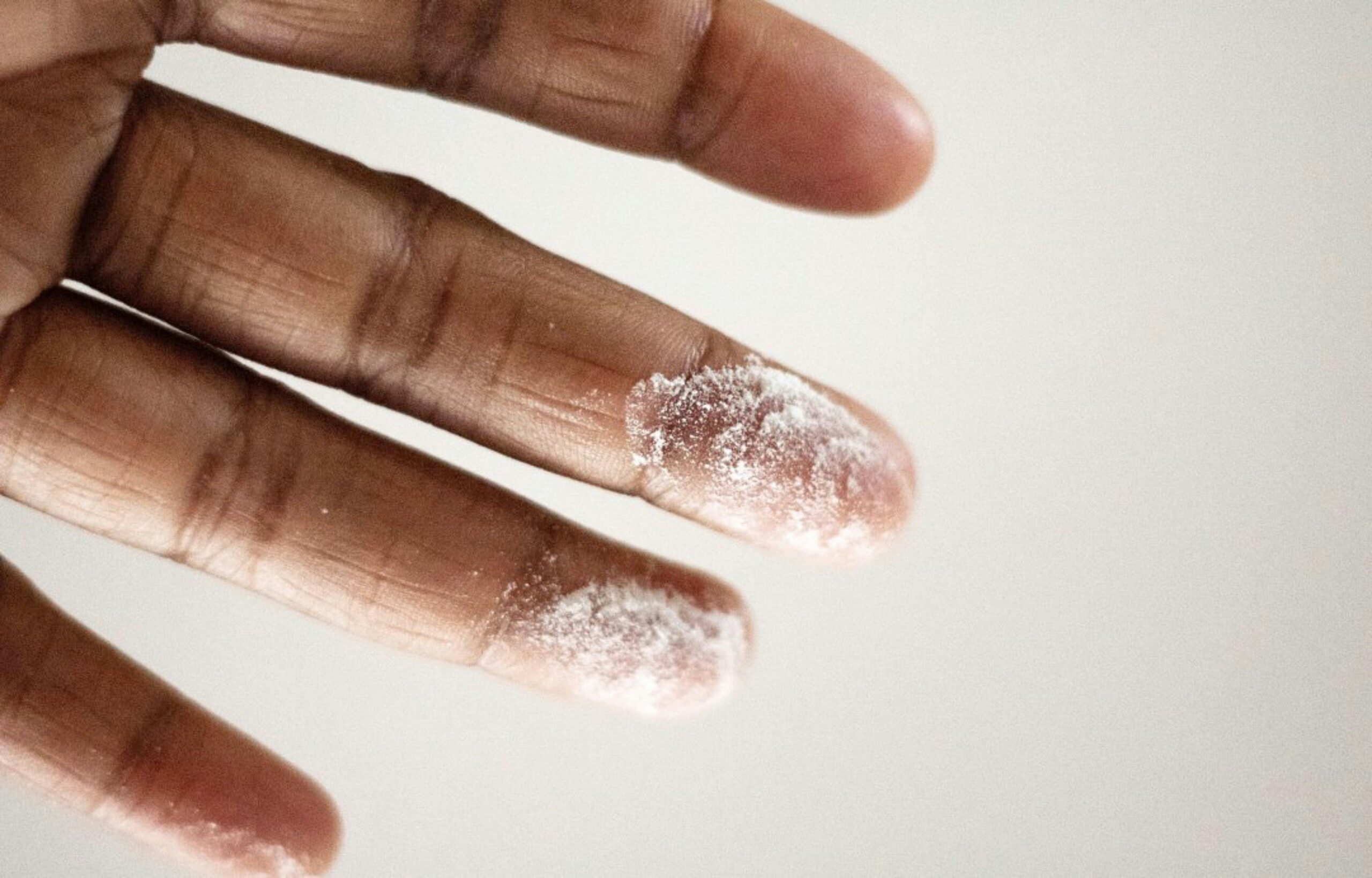 Close-up image showing a dirty nail clipper with visible debris