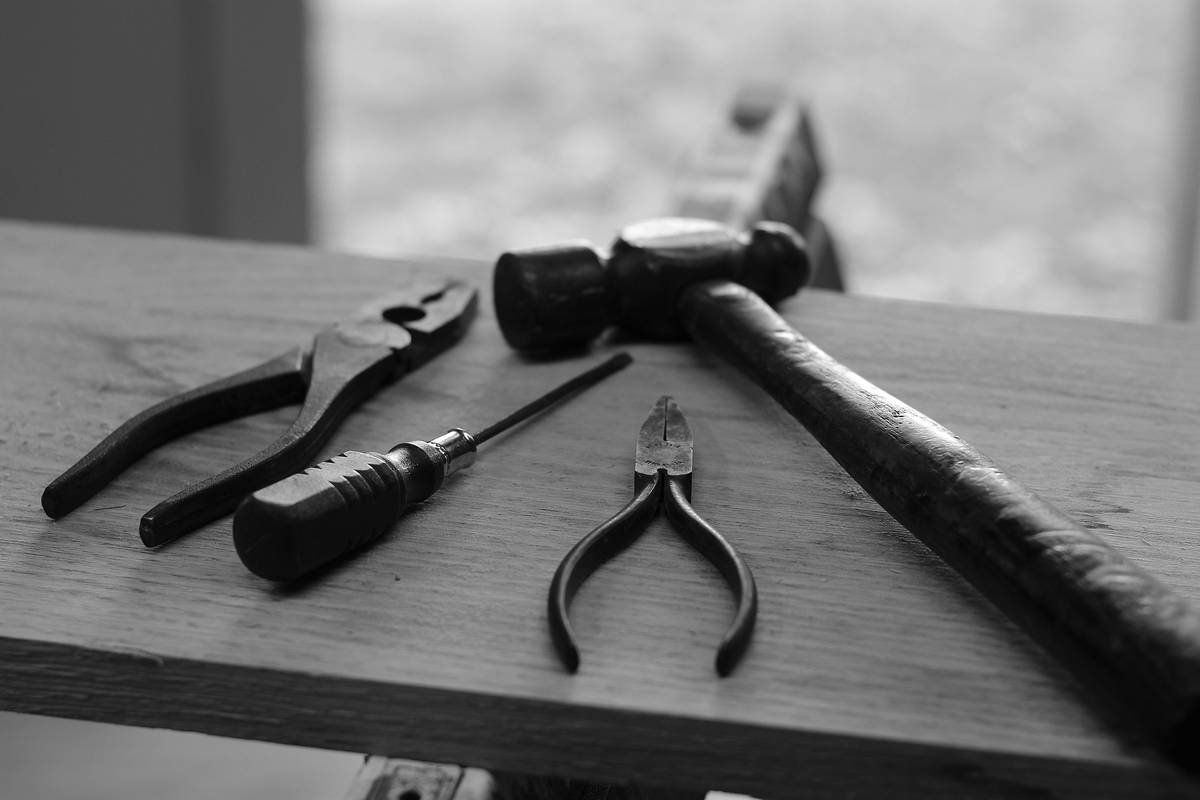 A close-up photo of dull nail clippers failing to trim nails properly.
