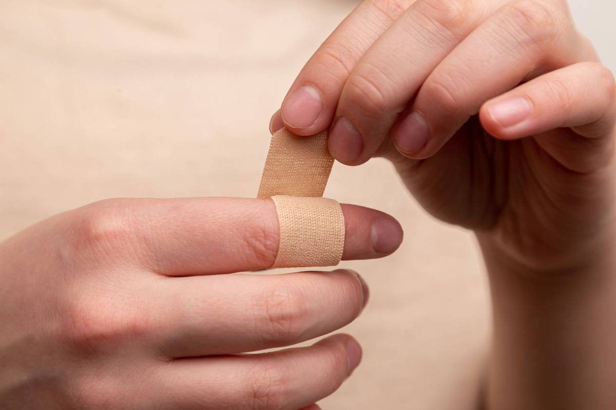 Close-up photo demonstrating proper nail clipping technique