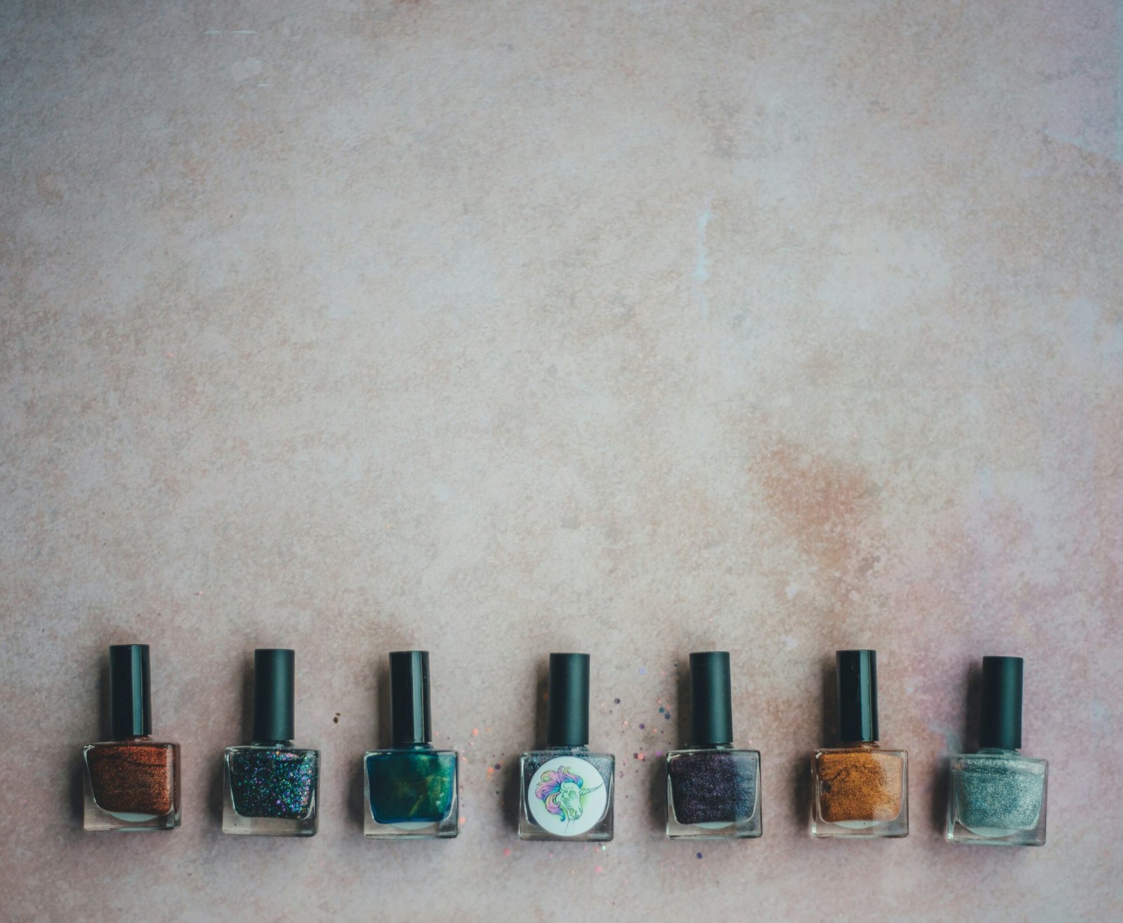 Neatly arranged nail tools in labeled compartments inside a drawer