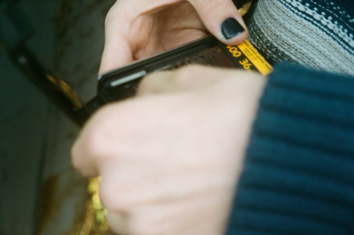 A photo of a professional nail artist demonstrating a manicure routine
