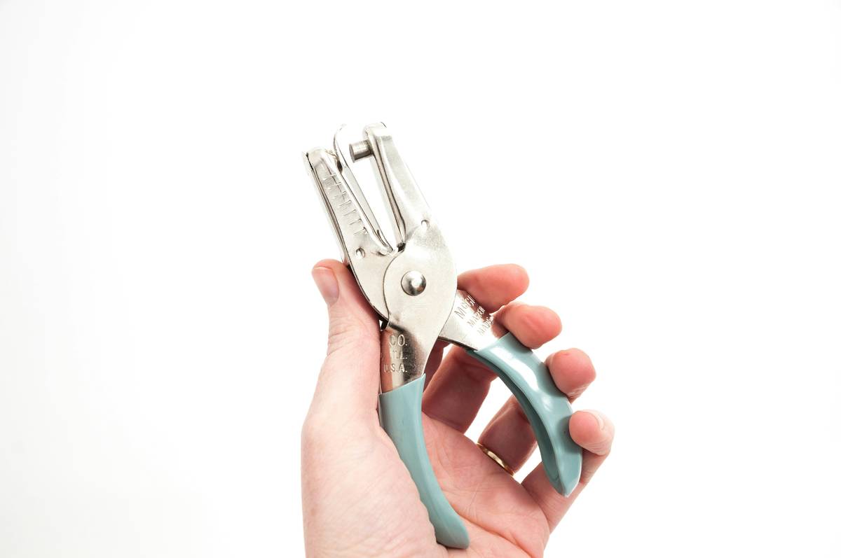Close-up shot of adjustable clippers being used to trim nails