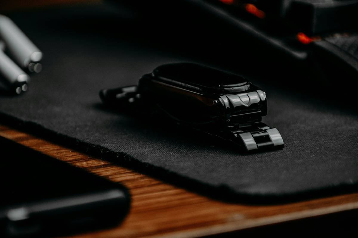a close up of a mouse pad with a watch on it